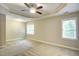 Large bedroom with tray ceiling, with multiple windows at 1354 Red Bud Ct, Wake Forest, NC 27587