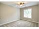 Bright bedroom featuring a ceiling fan and a large window at 1354 Red Bud Ct, Wake Forest, NC 27587