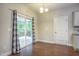 Dining area with hardwood floors and sliding glass doors leading to a deck or patio at 1354 Red Bud Ct, Wake Forest, NC 27587