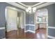 Open dining area with hardwood floors connecting seamlessly to the kitchen and other living spaces at 1354 Red Bud Ct, Wake Forest, NC 27587