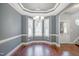 Bright dining area with hardwood floors, a decorative ceiling, and a view to the outdoor scenery at 1354 Red Bud Ct, Wake Forest, NC 27587