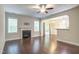 Inviting living room with dark wood floors, fireplace, and sliding glass doors to the patio at 1354 Red Bud Ct, Wake Forest, NC 27587