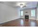 Spacious living room with dark wood floors, fireplace, and ceiling fan at 1354 Red Bud Ct, Wake Forest, NC 27587