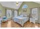 Sun-filled bedroom with a vaulted ceiling, plush carpeting, and large windows at 14 Wedgewood Pl, Clayton, NC 27527