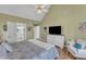 Light-filled bedroom with vaulted ceiling and an ensuite bathroom at 14 Wedgewood Pl, Clayton, NC 27527