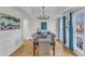 Bright dining room with a stylish chandelier, hardwood floors, and elegant decor at 14 Wedgewood Pl, Clayton, NC 27527