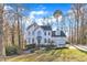Traditional two-story home with an attached two-car garage and a well-maintained lawn at 14 Wedgewood Pl, Clayton, NC 27527