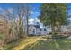 Spacious two-story home with an attached two-car garage surrounded by lush greenery and trees at 14 Wedgewood Pl, Clayton, NC 27527