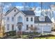 Charming two-story home with a manicured front yard and attached two-car garage at 14 Wedgewood Pl, Clayton, NC 27527
