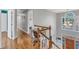 Bright hallway featuring wood floors and a home office area at 14 Wedgewood Pl, Clayton, NC 27527