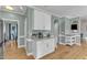 Kitchen area with granite countertops, white cabinets, and a dedicated coffee station at 14 Wedgewood Pl, Clayton, NC 27527