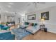 Spacious living room features hardwood floors and a comfortable white sectional at 14 Wedgewood Pl, Clayton, NC 27527