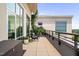 Charming balcony with seating and lush greenery, creating a serene outdoor retreat at 140 W Franklin St # 406, Chapel Hill, NC 27516