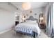 Elegantly designed bedroom with patterned walls, a plush bed, and sophisticated décor with natural light at 140 W Franklin St # 406, Chapel Hill, NC 27516