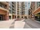 Exterior view of the modern apartment courtyard and upscale landscaping at 140 W Franklin St # 406, Chapel Hill, NC 27516