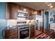 Stylish kitchen boasts stainless appliances, dark cabinets, granite counters, and modern lighting at 140 W Franklin St # 406, Chapel Hill, NC 27516