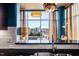 Bright kitchen with pendant lighting, stainless steel appliances, and expansive windows offering a scenic view at 140 W Franklin St # 406, Chapel Hill, NC 27516