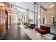 Beautiful building lobby with floor-to-ceiling windows, stylish seating, and convenient elevator access at 140 W Franklin St # 406, Chapel Hill, NC 27516