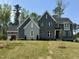 Charming two-story home features a landscaped yard, large windows, and a modern color scheme at 1433 Starry Night Ct, Raleigh, NC 27613