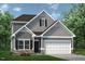 Two-story home with gray siding, stone accents, and a two-car garage at 147 Vega Loop, Sanford, NC 27330
