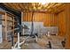 Spacious basement area with weightlifting equipment and storage solutions at 155 Georgetown Woods Dr, Youngsville, NC 27596