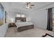 Spacious bedroom with tray ceiling, ceiling fan, and neutral tones offers a relaxing retreat at 155 Georgetown Woods Dr, Youngsville, NC 27596
