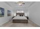 Spacious bedroom with tray ceiling, ceiling fan, and neutral tones offers a relaxing retreat at 155 Georgetown Woods Dr, Youngsville, NC 27596