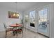 Cozy breakfast nook offers natural light with large windows and deck access at 155 Georgetown Woods Dr, Youngsville, NC 27596