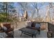 Spacious deck with comfortable seating area offers a relaxing outdoor space at 155 Georgetown Woods Dr, Youngsville, NC 27596