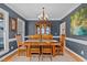 Traditional dining room featuring a chandelier, wood furniture, and neutral colors at 155 Georgetown Woods Dr, Youngsville, NC 27596