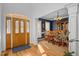 Inviting entryway features a wooden front door with decorative glass and hardwood floors at 155 Georgetown Woods Dr, Youngsville, NC 27596