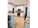 Bright kitchen with granite countertops, stainless steel appliances, and white cabinets at 155 Georgetown Woods Dr, Youngsville, NC 27596
