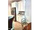 Bright kitchen features white cabinetry, stainless steel refrigerator, and tile backsplash at 155 Georgetown Woods Dr, Youngsville, NC 27596