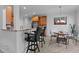 Inviting kitchen flows into a breakfast nook with a stone countertop bar at 155 Georgetown Woods Dr, Youngsville, NC 27596