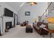 Living room with a fireplace, TV, and leather furniture offering a comfortable space at 155 Georgetown Woods Dr, Youngsville, NC 27596