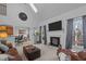 Open-concept living room with a fireplace, and a view of the breakfast area at 155 Georgetown Woods Dr, Youngsville, NC 27596