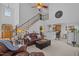 Open living room with a fireplace, stairs and a view of the kitchen and breakfast area at 155 Georgetown Woods Dr, Youngsville, NC 27596