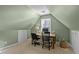 Cozy office featuring two chairs, a desk, and natural light at 155 Georgetown Woods Dr, Youngsville, NC 27596