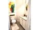 Stylish powder room featuring modern vanity, granite countertop, and decorative art at 155 Georgetown Woods Dr, Youngsville, NC 27596