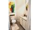 Stylish powder room featuring modern vanity, granite countertop, and decorative art at 155 Georgetown Woods Dr, Youngsville, NC 27596