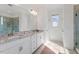 Elegant bathroom with double vanity, granite countertops, and a glass-enclosed shower, blending style and functionality at 169 Hidden Bluff Dr, Chapel Hill, NC 27517