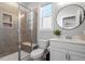 Bathroom featuring a glass shower with a built-in seat, toilet, and vanity at 169 Hidden Bluff Dr, Chapel Hill, NC 27517