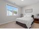 Bright bedroom with a large window, comfortable bed, and neutral décor creates a calming and inviting atmosphere at 169 Hidden Bluff Dr, Chapel Hill, NC 27517
