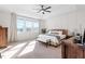 Bright bedroom featuring tray ceiling, panel accents, neutral colors, and a large window for natural light at 169 Hidden Bluff Dr, Chapel Hill, NC 27517