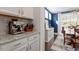 Cozy dining area with modern appliances adjacent to a bright dining room with stylish decor at 169 Hidden Bluff Dr, Chapel Hill, NC 27517
