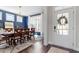 Elegant dining room with stylish lighting, a large window, and ample seating at 169 Hidden Bluff Dr, Chapel Hill, NC 27517