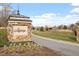 Stone Legacy Jordan Lake sign and landscaping at community entrance at 169 Hidden Bluff Dr, Chapel Hill, NC 27517