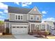 Lovely two-story home boasting a classic design with a covered front porch and attached garage at 169 Hidden Bluff Dr, Chapel Hill, NC 27517
