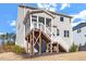 Back exterior showing a deck and stairs to the yard for easy access from the house to outdoor space at 169 Hidden Bluff Dr, Chapel Hill, NC 27517