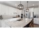 Beautiful kitchen with a large island, stainless steel appliances, and sleek white cabinetry at 169 Hidden Bluff Dr, Chapel Hill, NC 27517